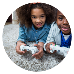 Boy and girl laying on the floor playing video games. Specialty Vacuums for Thick Carpet and Shag Carpet - Starks Vacuum Stores in Portland OR Vancouver WA and Bend OR