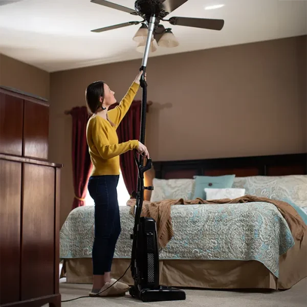 Cleaning ceiling with extended reach tool on Riccar R25 Deluxe Vacuum