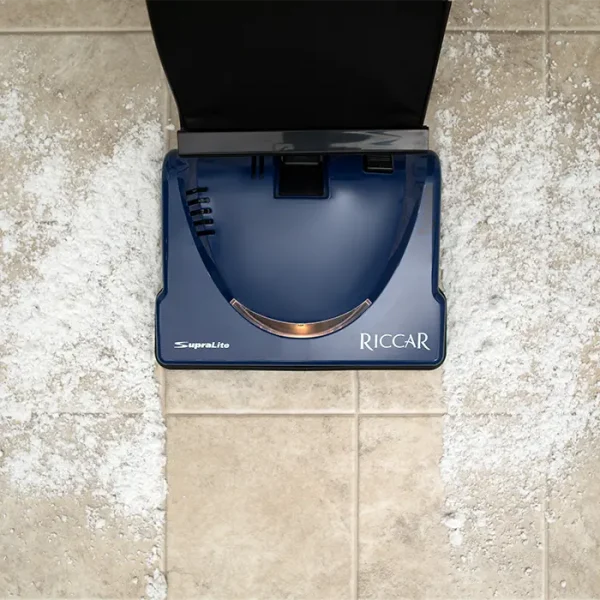 Vacuuming on tile with Riccar Cordless SupraLite Vacuum