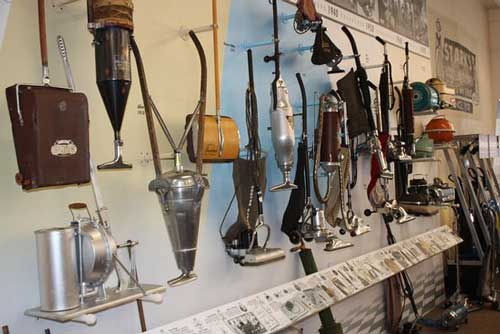 Wall of Vacuums throughout history on display for Stark's Vacuum museum. 