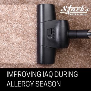 Vacuum cleaning a carpet - Improving IAQ During Allergy Season